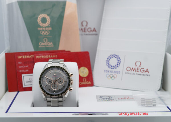 Omega SPEEDMASTER TOKYO 2020 OLYMPICS GREEN BEZEL GREY DIAL STEEL GOLD FULL SET - Image 2
