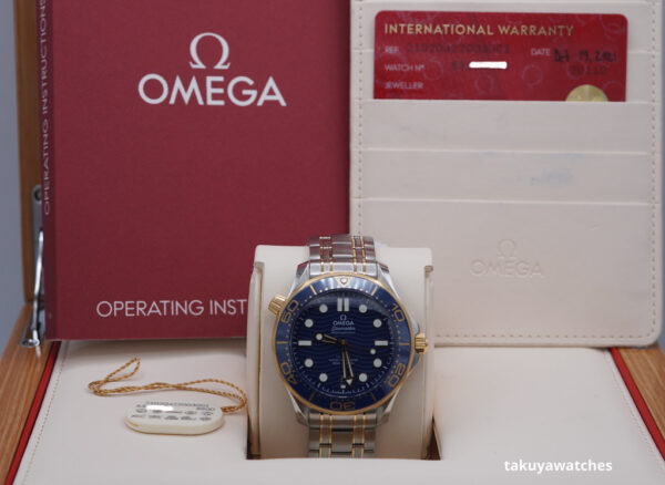 Omega SEAMASTER DIVER 300M CO-AXIAL MASTER 18K YG STEEL BLUE DIAL 2021 - Image 2